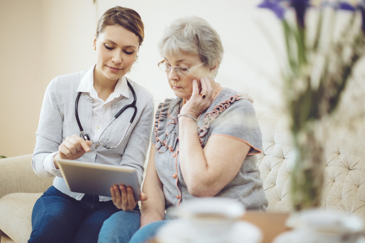 Doctor and a patient discussing an at-home clinical trial